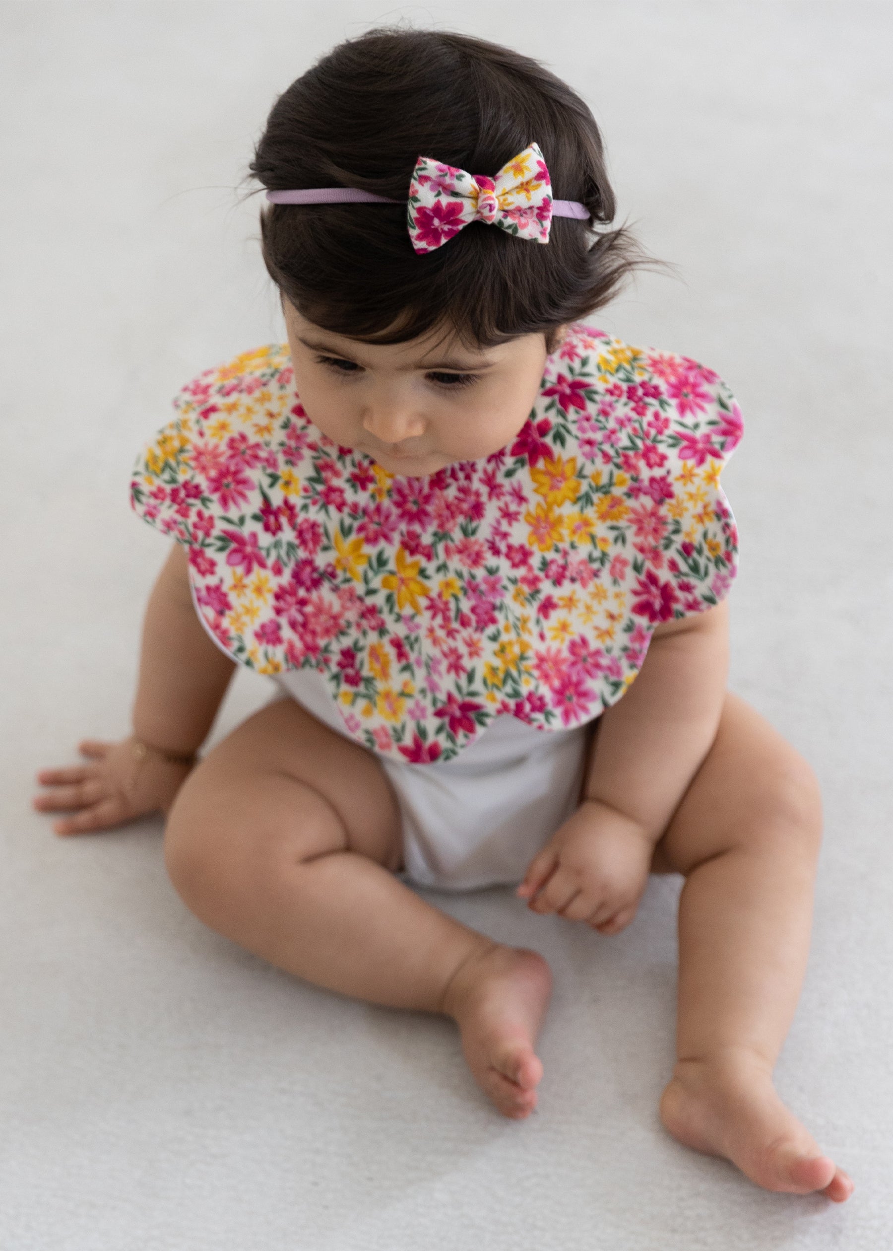 Chasing Flower Fields Scalloped Bib With Bow